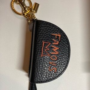 Coach x Jean Michel Basquiat “Famous” Mini half moon